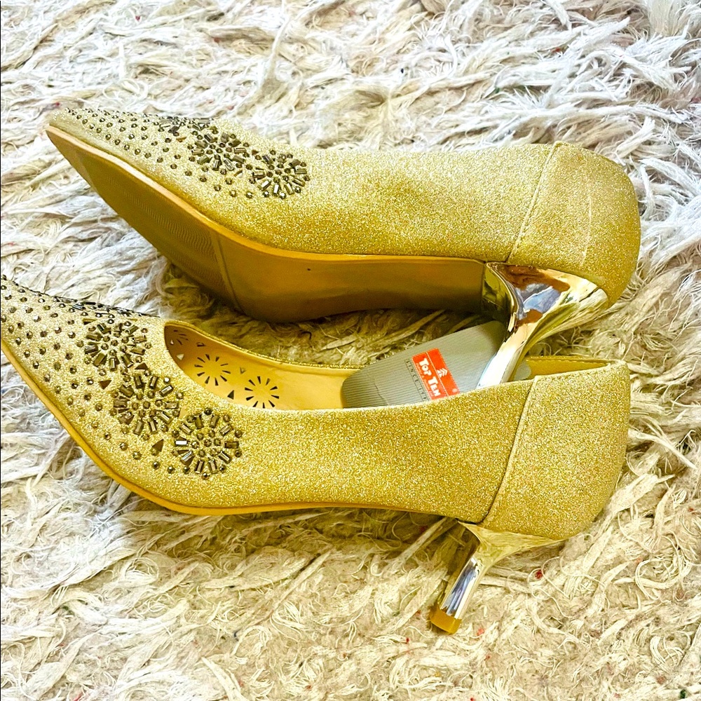 Woman’s embellished party shoe with tag attached